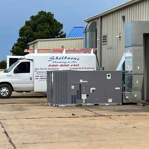 Our service vehicle parked by an outdoor unit