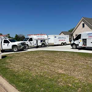 Our vehicles parked outside a residential home