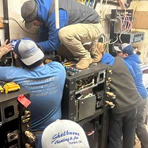 Our team working on repairing an indoor unit